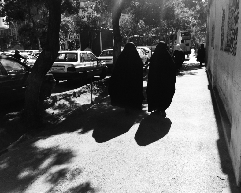 2 Iranian woman passing by